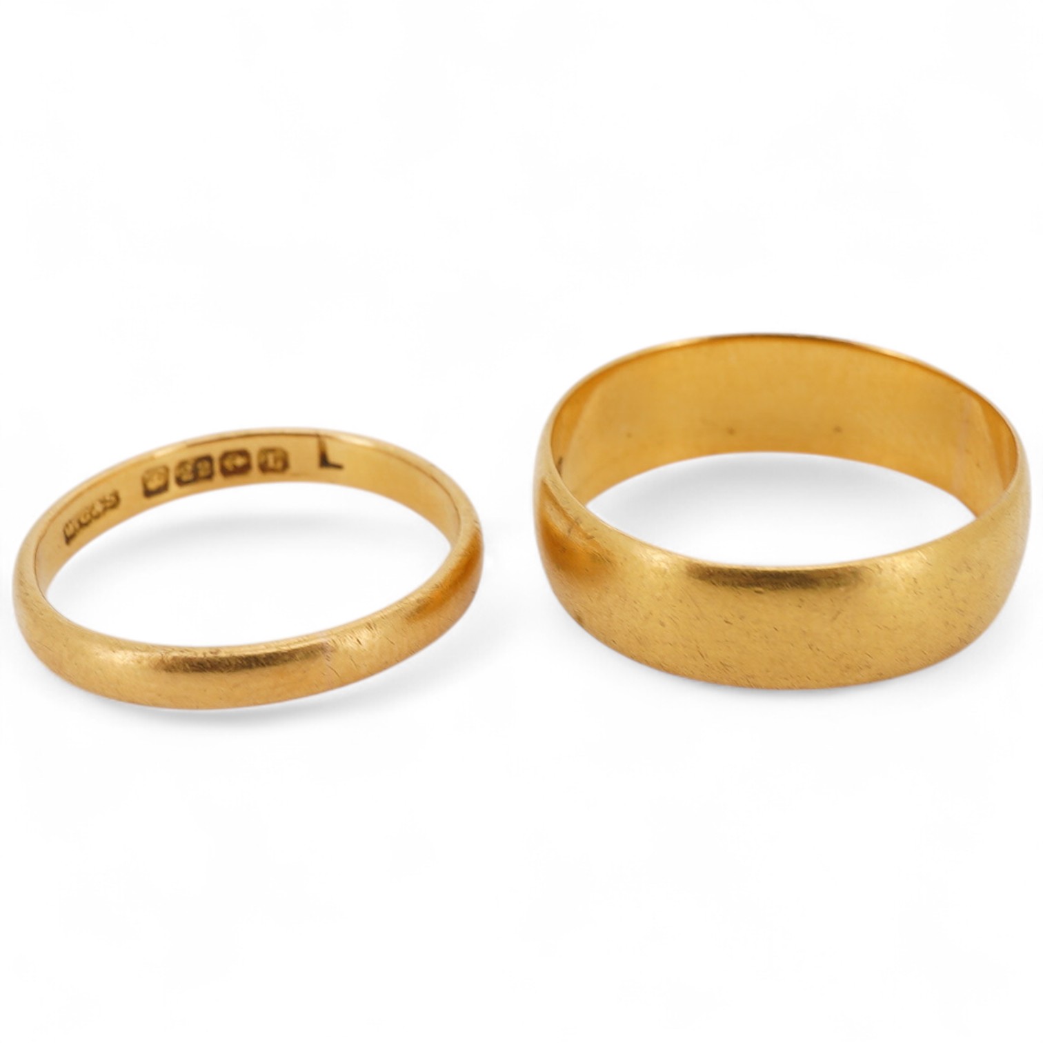 Two 22ct gold wedding bands, one 2.5mm, size K1/2, the other 6mm, size P, each with British hallmarks, combined gross weight approximately 6.5 grams